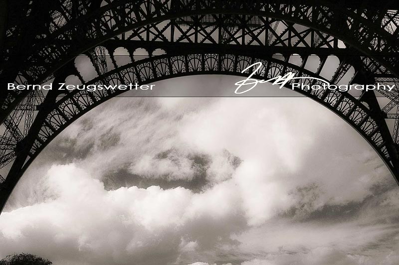 underneath the Eifeltower with clouds moving by, Paris