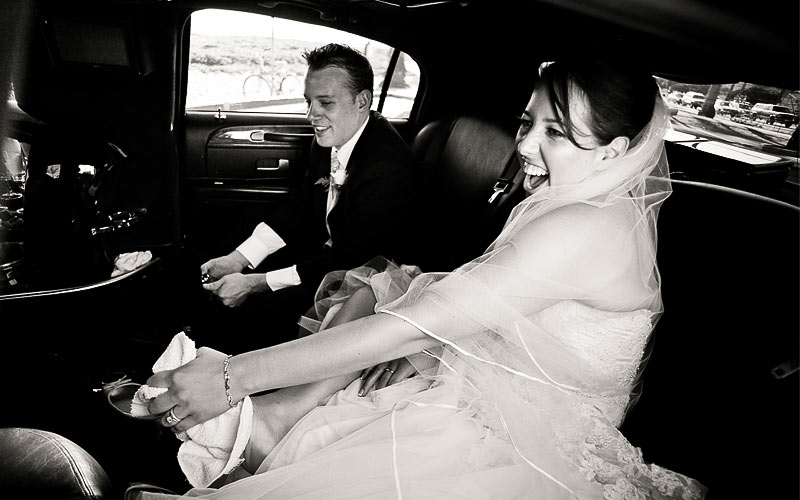 Bride and Groom rubbing sand off their feet