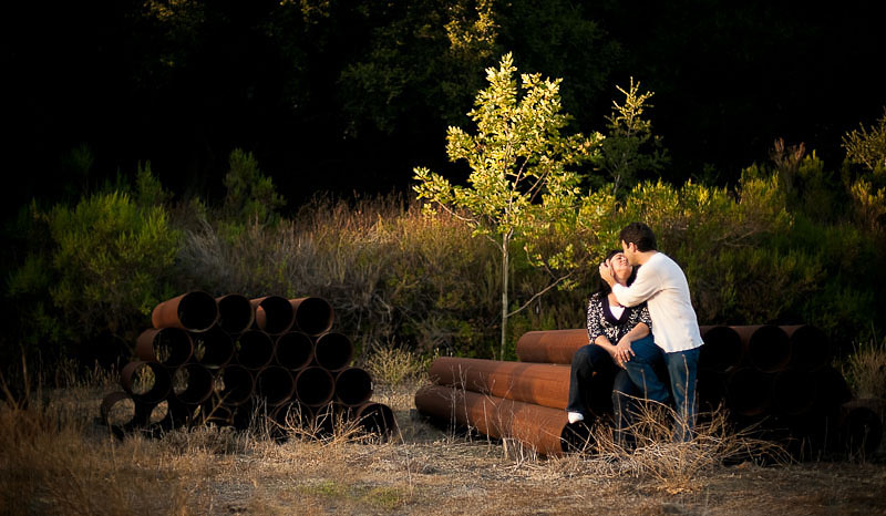 Couple kissing in the last sun-rays on an old construction site, Avila Beach