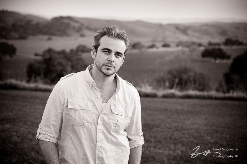 Portrait of Brandon overlooking Firestone Vineyard, Santa Ynez.