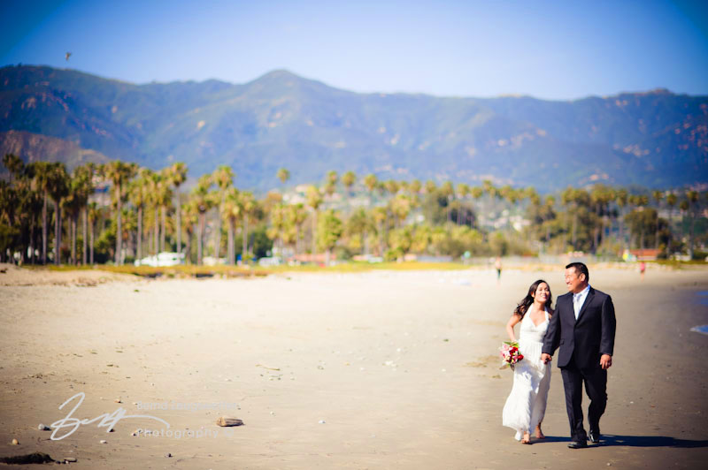 Wedding couple enjoying beautiful East Beach, Santa Barbara.