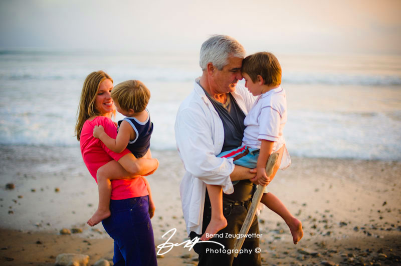 Parents with their two boys on the beach, Goleta.