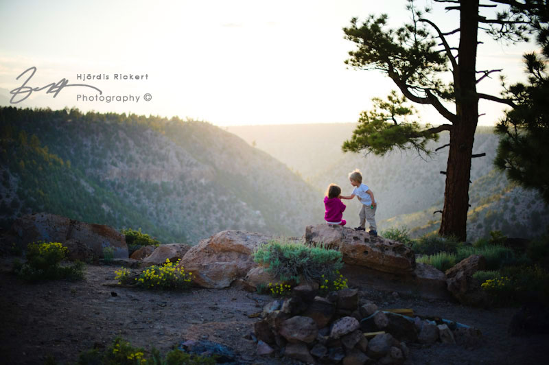 Children at edge of Owens Gorge at sunset.