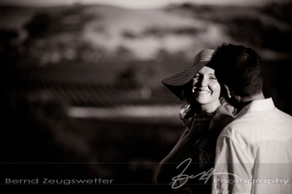 Fun Portrait of engaged couple overlooking vineyards, Santa Ynez.