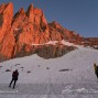 Climbers below the new line in alpenglow.