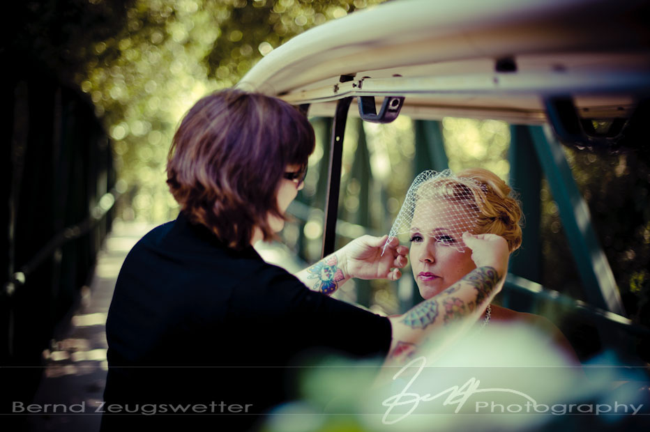 Wedding photography of bride getting vail set in place at Sycamore Springs Resort