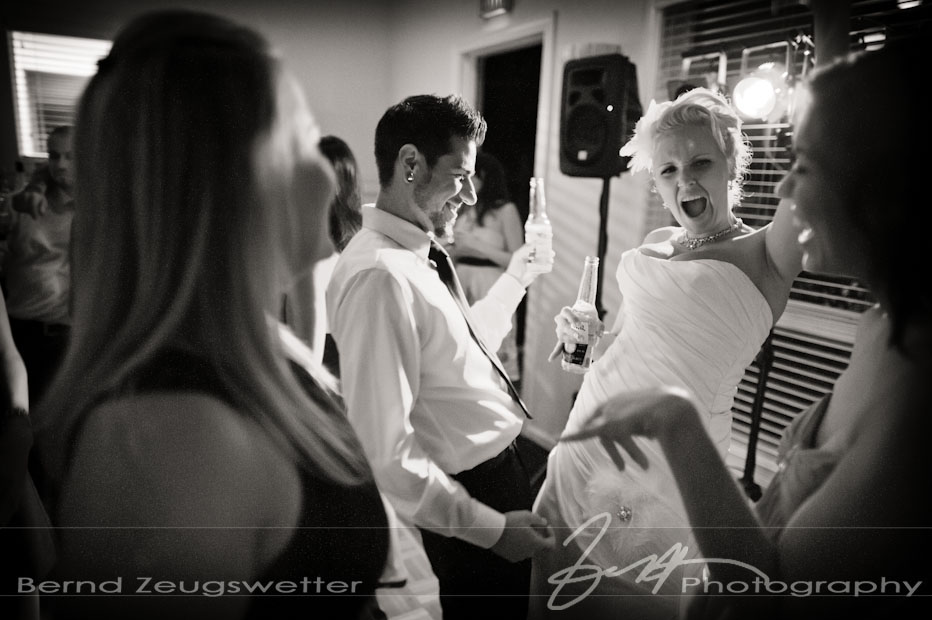 Bride and Groom rockin' out on the dance floor, wedding photograhy.