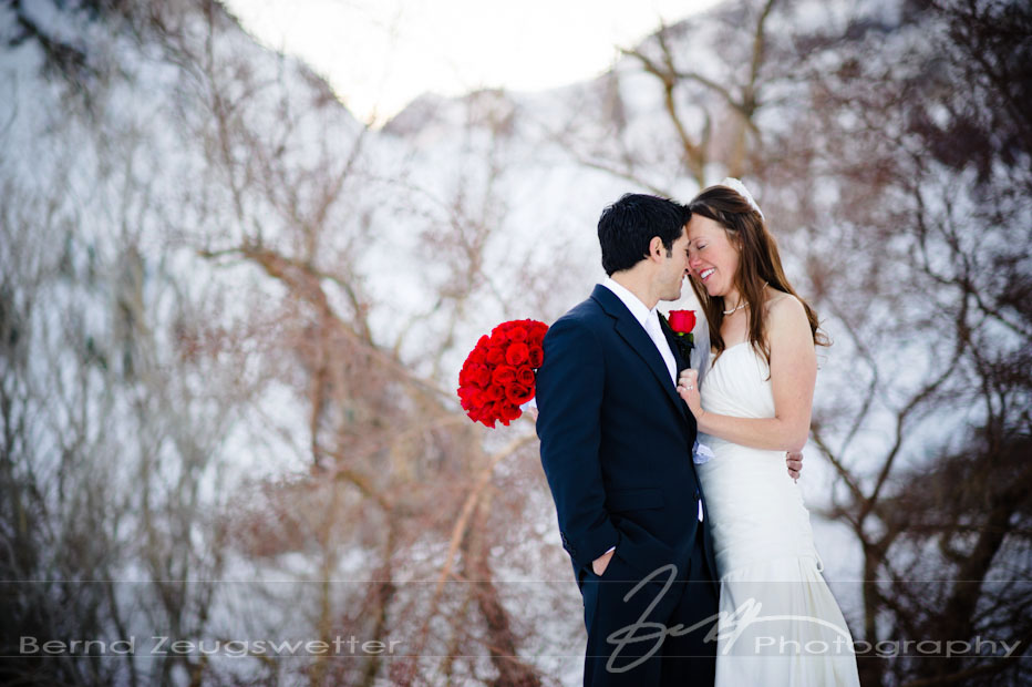 Wedding couple in the snow at Convict Lake Resort, Eastern Sierra, California.