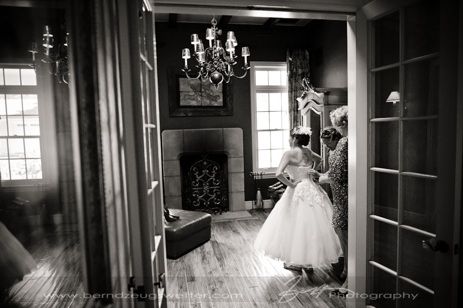 Bride getting ready wih help from Bridesmaids.