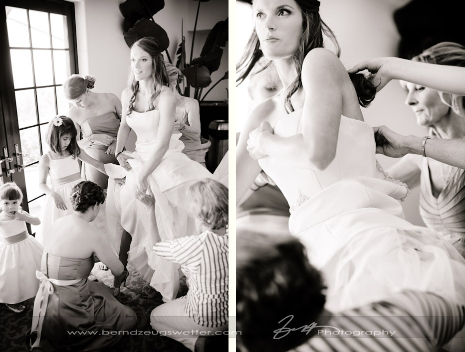 Bride getting ready, putting on dress.