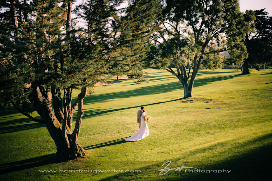 Bride and Groom walking at Montecito Country Club at sunset.
