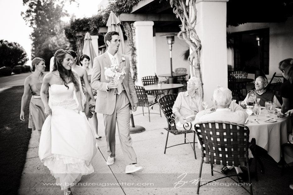 Bride and Groom walking by guests at restaurant, Montecito Wedding Photographer