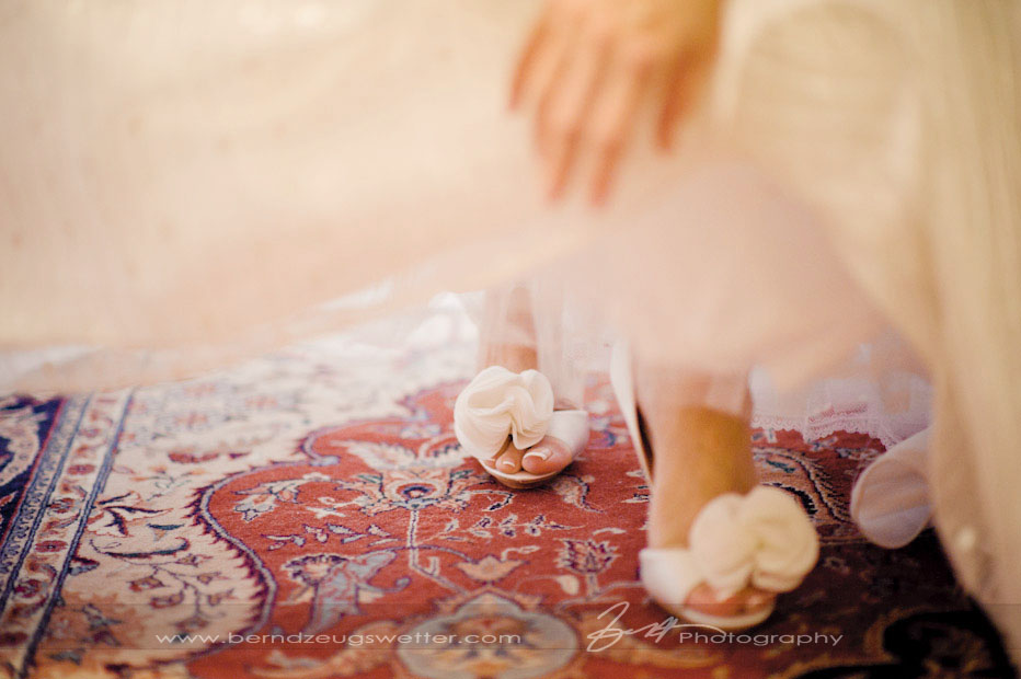 Bride in her wedding dress, detail of shoes, Montecito wedding photographer.