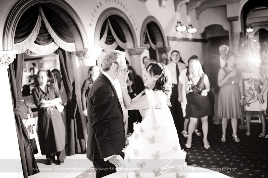 Bride and groom and wedding cake at Granada Theater, Santa Barbara.