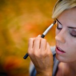 Bridesmaid getting ready with make-up at the Four Seasons Biltmore.