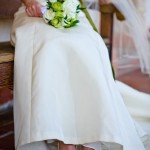 Detail of wedding gown and bride's shoes, Santa Barbara.