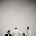Groom and groomsmen waiting patiently.