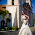 Bridal shot, fashion style, with the Mission's bell towers behind.