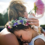 Flowergirl being held.
