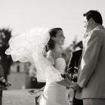 Bride and groom in the wind during the ceremony, Santa Barbara.