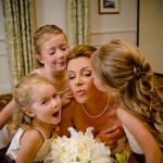 Bride getting kisses from the flower girls, Santa Barbara Biltmore.