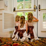 Flower girls peering out the window at the Four Seasons Biltmore.