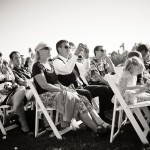 Wedding guests taking photographs during the ceremony, Santa Barbara.