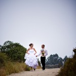 Picture of bride and groom walking to Rincon Beach near Carpinteria
