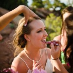 Bride reapplying lip gloss.