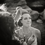 Bridesmaids helping bride with make-up touch-up.