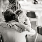 Emotional embrace at the wedding reception.