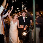 Bride and groom leaving the reception with sparklers.